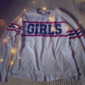 I am selling a long sleeved shirt that says girls.